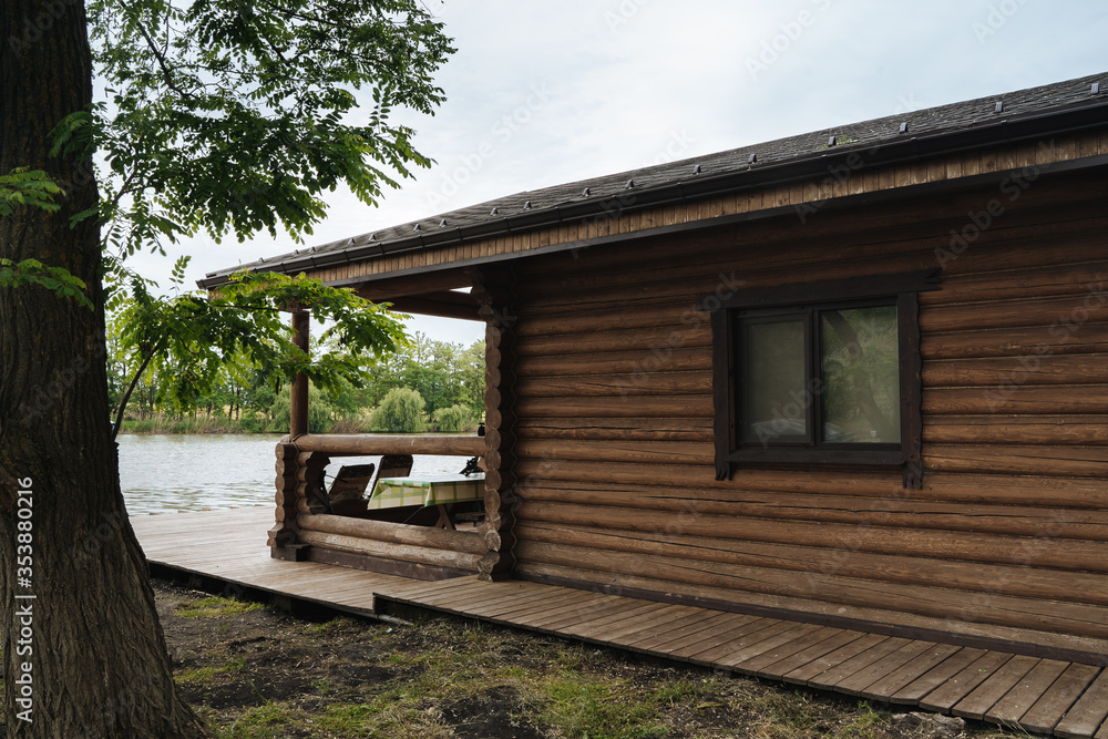Wooden log house on the river Bank Wooden log house on the river Bank