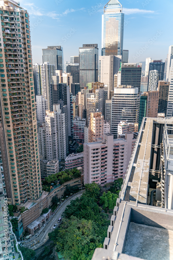 Fototapeta premium The amazing view of Hong-Kong cityscape full of skyscrapers from the rooftop.