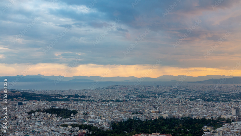 Athens city and  Piraeus port in the background