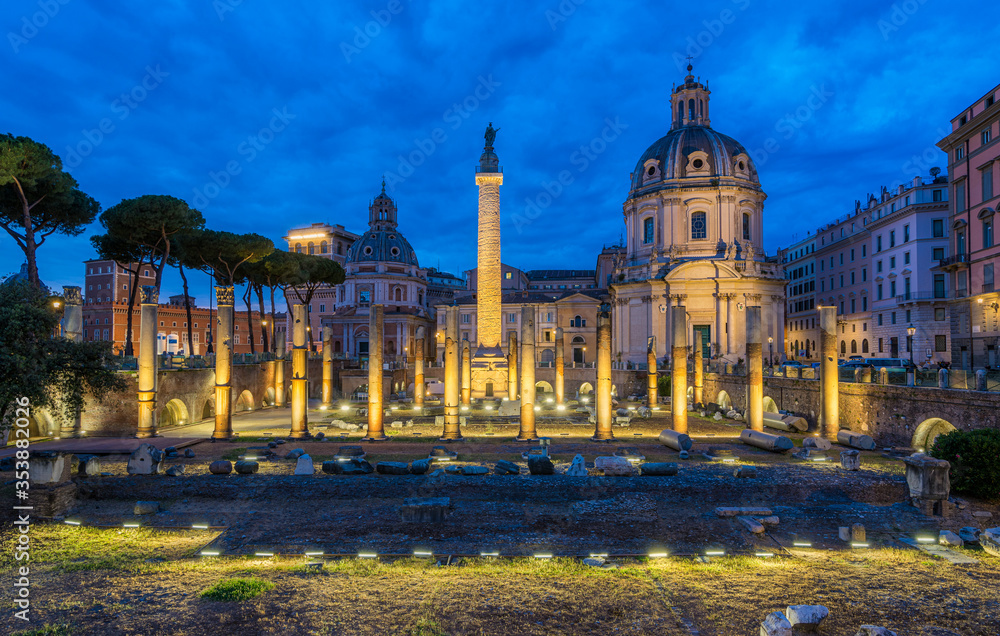 The Basilica Ulpia and the Trajan's Column at night in Rome, Italy.