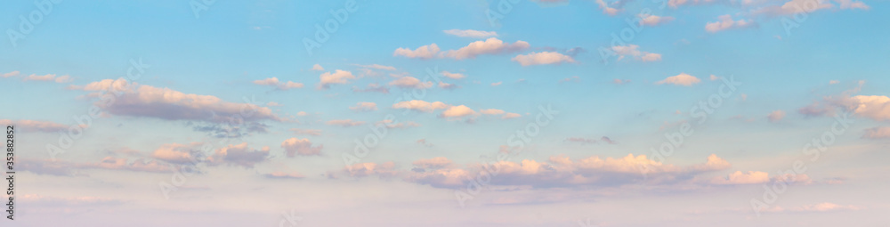 Panorama of blue sky with pink clouds during sunset Panorama of blue sky with pink clouds during sunset