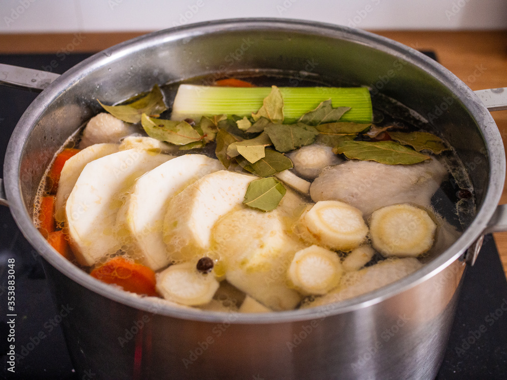 Broth - boiling chicken soup in pot
Broth - boiling chicken soup in pot