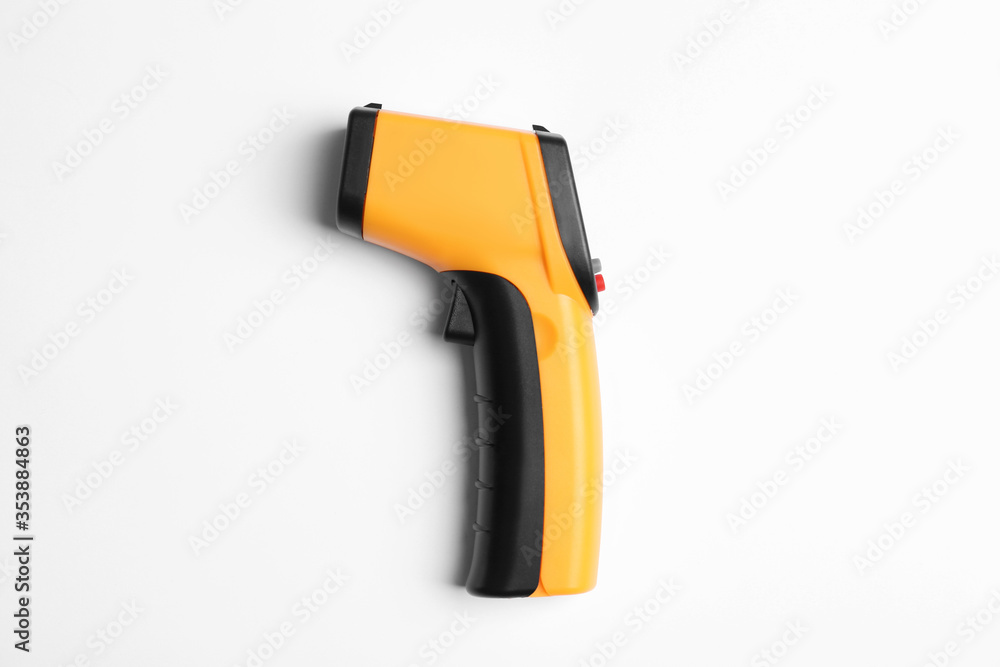 Modern non-contact infrared thermometer on white background, top view Modern non-contact infrared thermometer on white background, top view