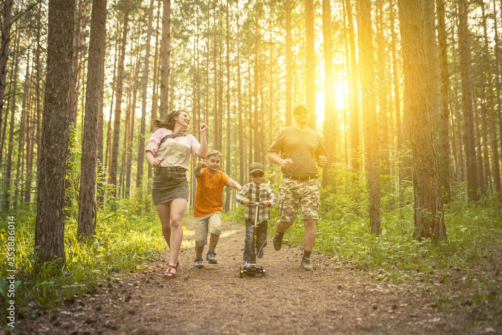 Fototapeta premium family walking in the park