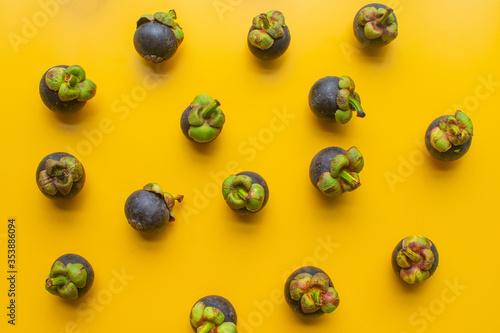 mangosteen fruit of Thailand on yellow background. soft focus.