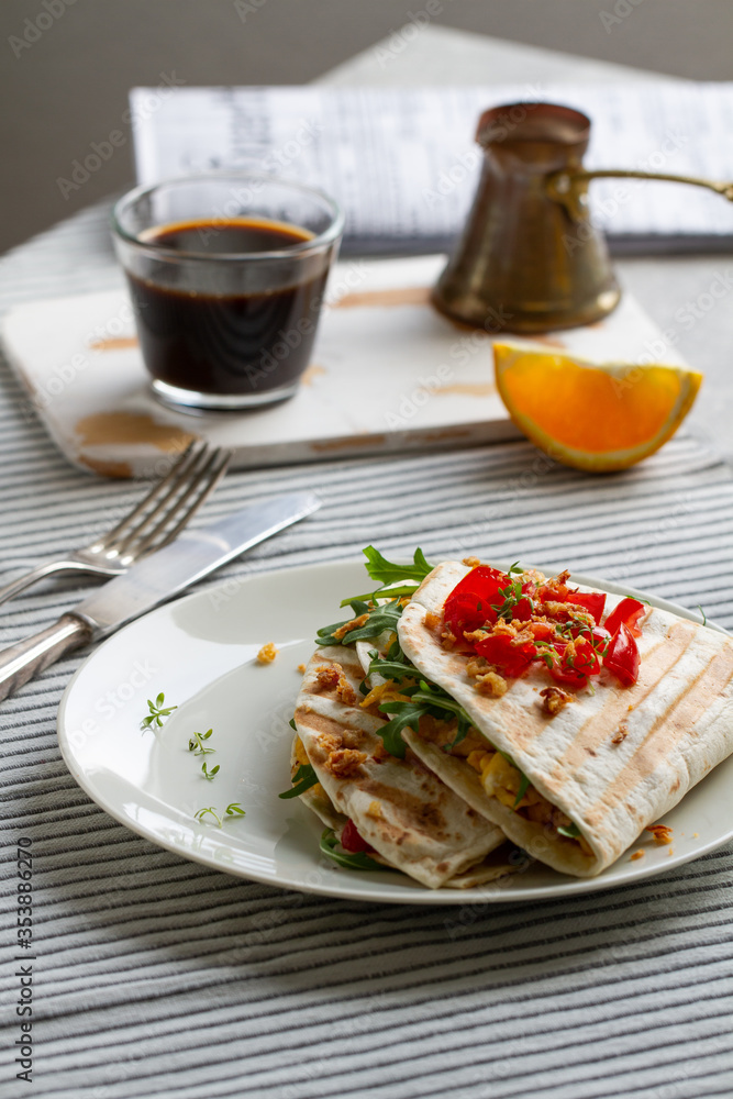 Tortilla wrap with eggs,arugula and tomatoes Tortilla wrap with eggs,arugula and tomatoes