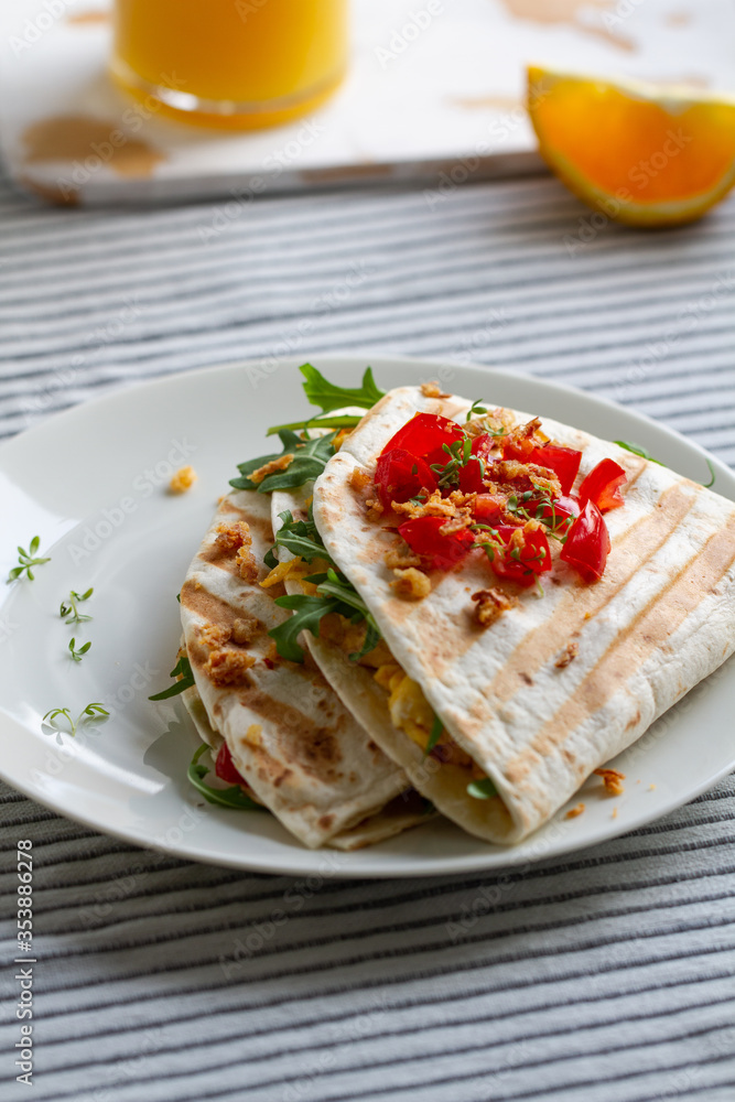 Tortilla wrap with eggs,arugula and tomatoes Tortilla wrap with eggs,arugula and tomatoes