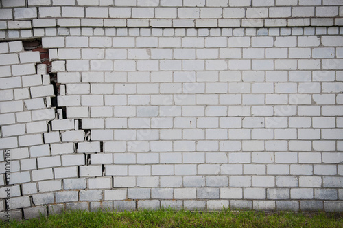 Brick house with a crack