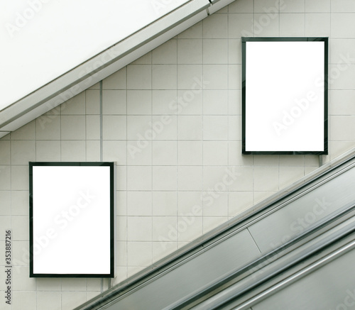 Small billboard beside the escalator.