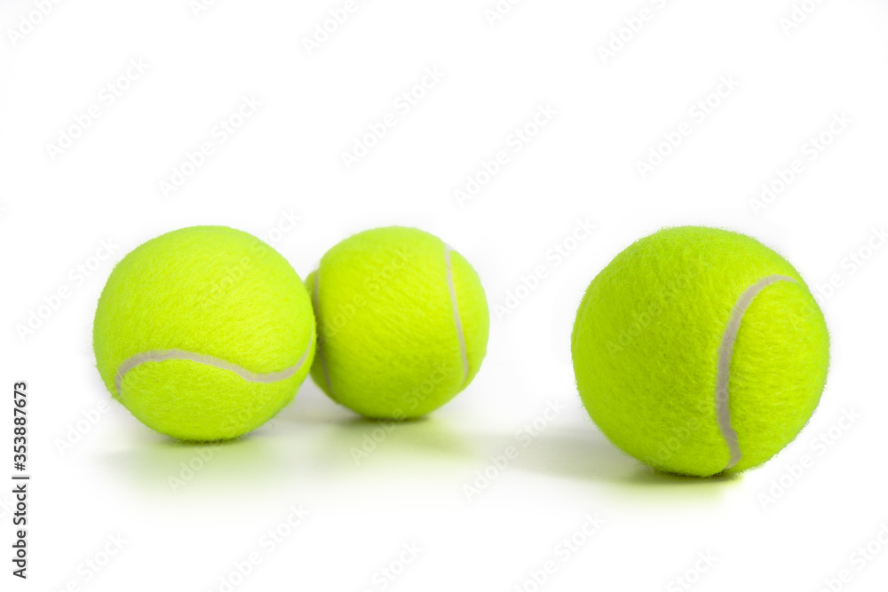 Tennis balls isolated on white. Still-life photo taken on studio with white background and softbox.
