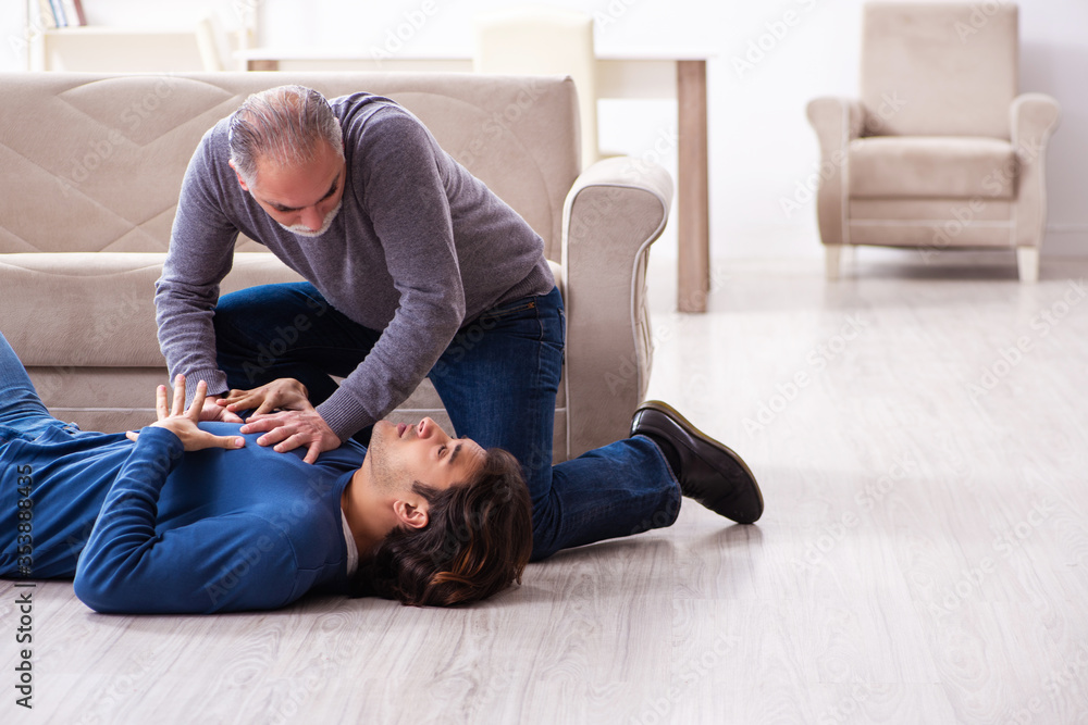 Grandfather and grandson in first aid concept Grandfather and grandson in first aid concept
