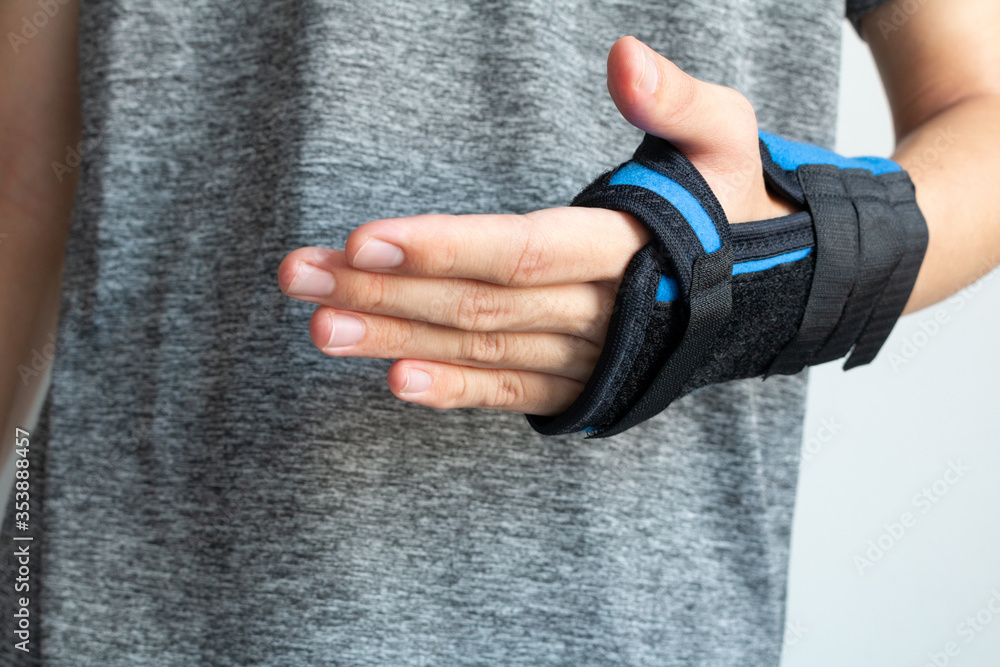 Hand injury. Broken wrist and arm with bandage. Using wrist immobilizer