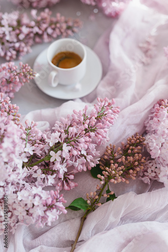 Flowers and coffee. Lilac and coffee, a beautiful composition. Flat lay. Flower concept.