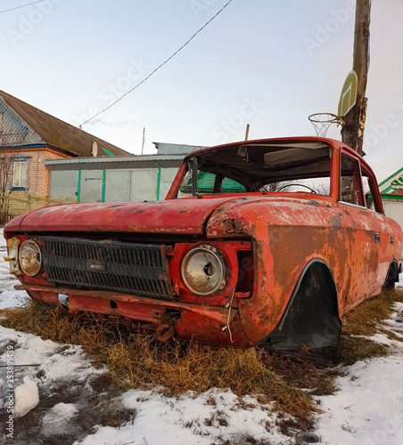 an old destroyed car on the street