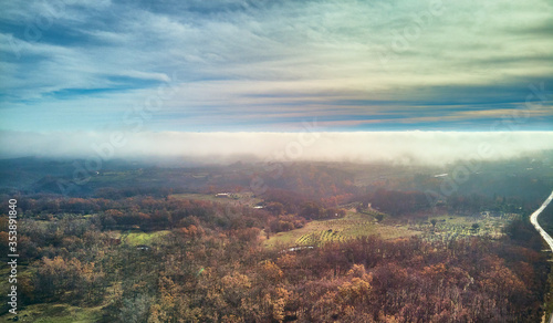 Aerial view of Autumn landscape with fog. Mountain landscape with fog