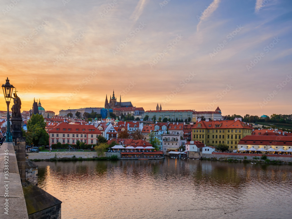 Amazing sunset over Prague town, Vltava river and Vitus Cathedral