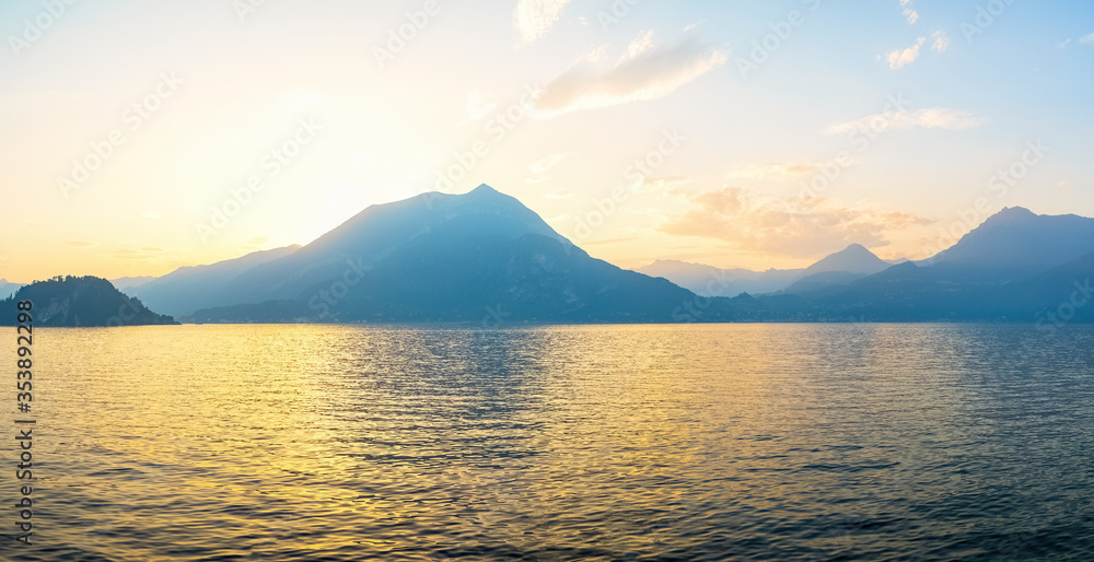 Panoramic view of sunset behind Alps mountains and Como lake