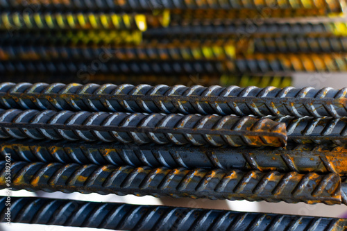 a stack of steel rebar at a constuction site