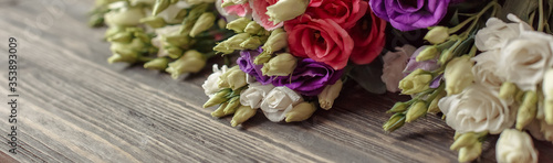 Bouquet of flowers on wooden background. Abstract spring background with bloom. © Daria Lukoiko