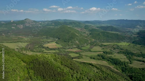 Wallpaper Mural Aerial video flying over green meadows, forests and hills overgrown with lush vegetation in the spring time. The picturesque valley between hills of Eastern Balkan Mountains. Torontodigital.ca