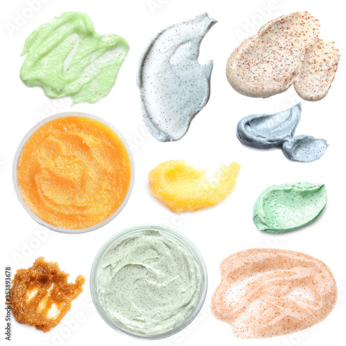 Set with different samples and containers of natural scrubs on white background, top view photo
