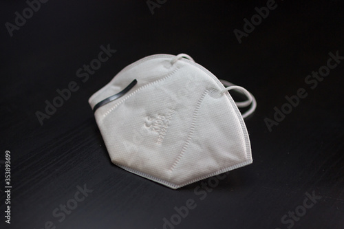 Face mask and corona virus protection isolated on a black background