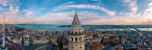 Fotobehang Panoramic view of Galata Tower and Istanbul Bosphorus with a cloudy sky