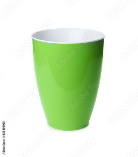 Green plastic flower pot isolated on white