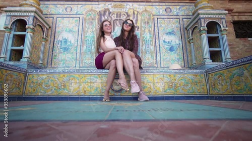 Girls of tourists pose in Seville, Spain photo