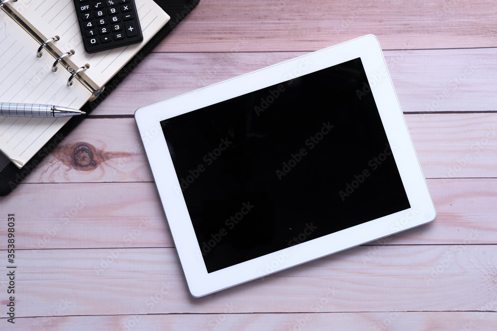 Top view of digital tablet with screen on desk Top view of digital tablet with screen on desk