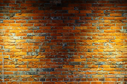 Old Brick Wall Texture Background with Spotlight on Surface.
