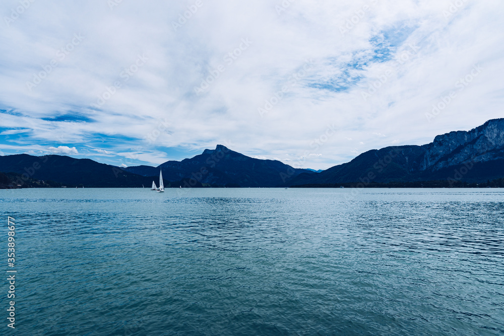 Calm Mondsee lake during windy afternoon