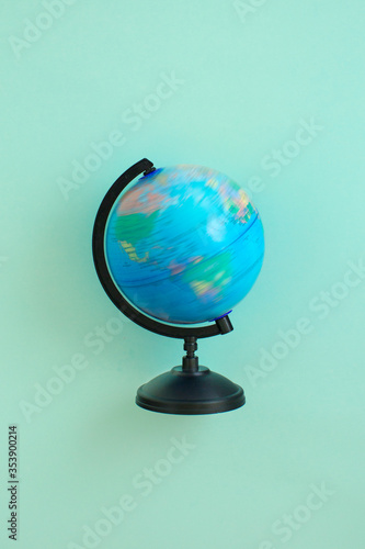 Spinning globe model on green background
