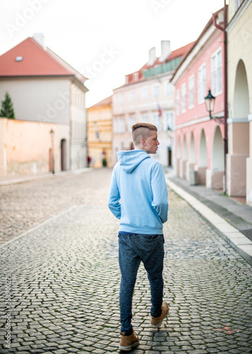 Teen boy wanders European street © Alyssa