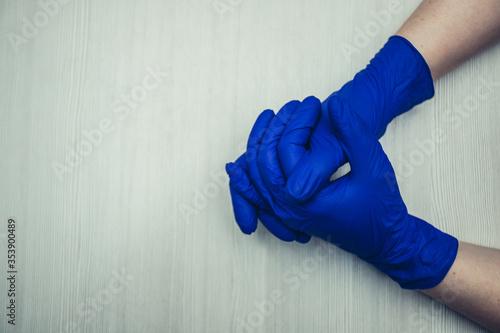 Hands in medical gloves