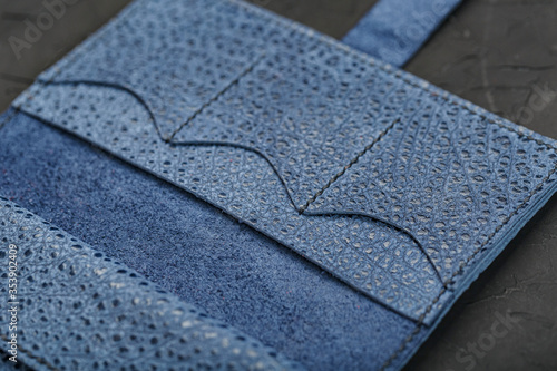 Texture blue leather closeup on a black background. © Alexander