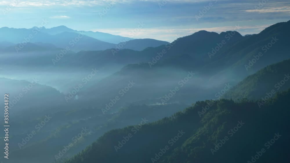 Aerial flying over a mountainous forest growing on the Himalayas mountain range Aerial flying over a mountainous forest growing on the Himalayas mountain range