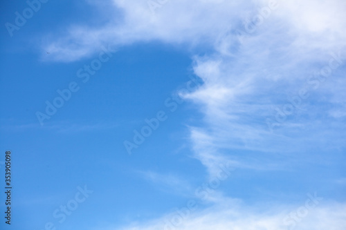 Blue sky background with clouds © plus
