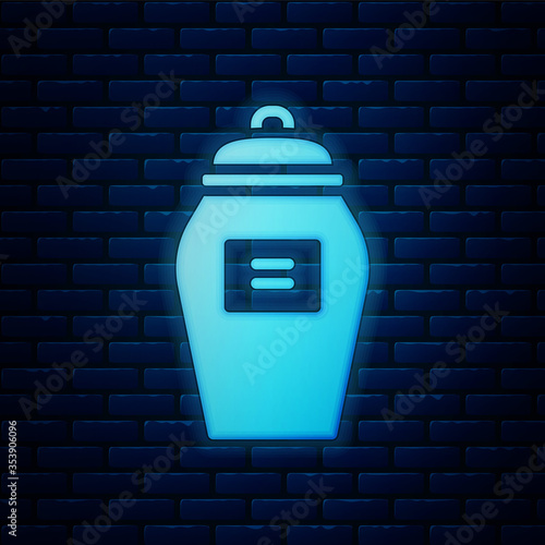 Glowing neon Funeral urn icon isolated on brick wall background. Cremation and burial containers, columbarium vases, jars and pots with ashes. Vector.