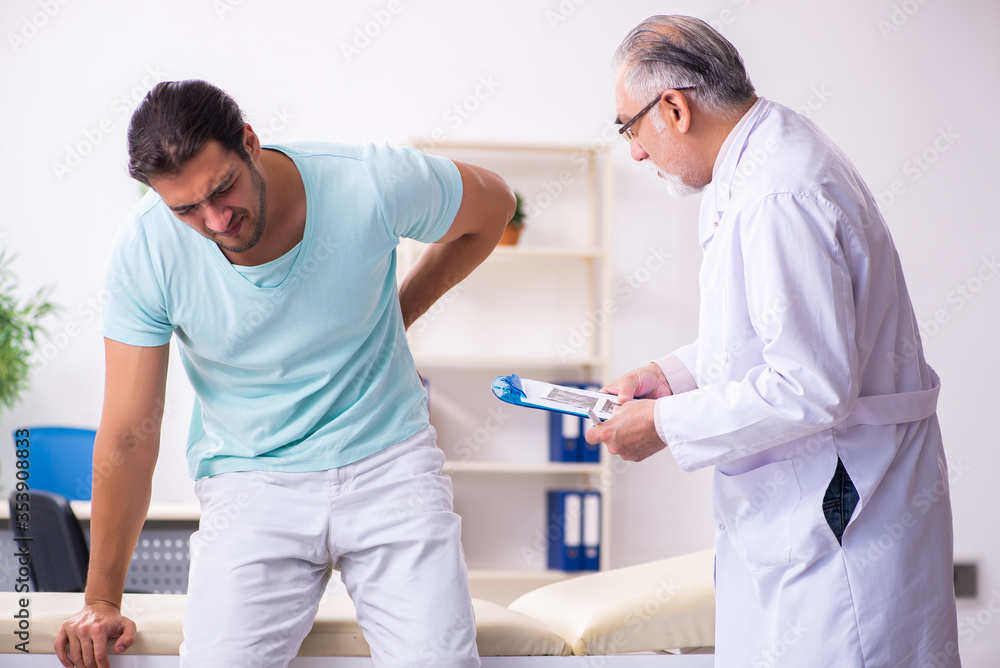 Young male patient visiting experienced doctor Young male patient visiting experienced doctor