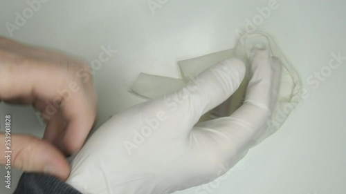 take off White and clean gloves protection against covid19  frontal view