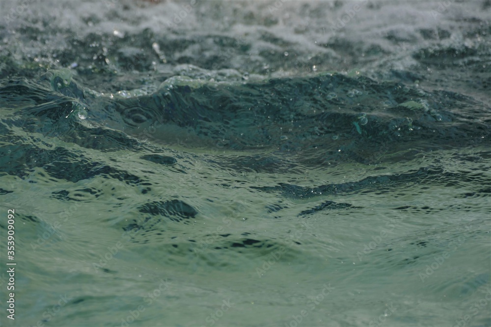Deep blue sea water surface with waves background