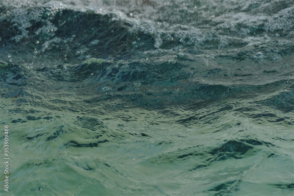 Deep blue sea water surface with waves background