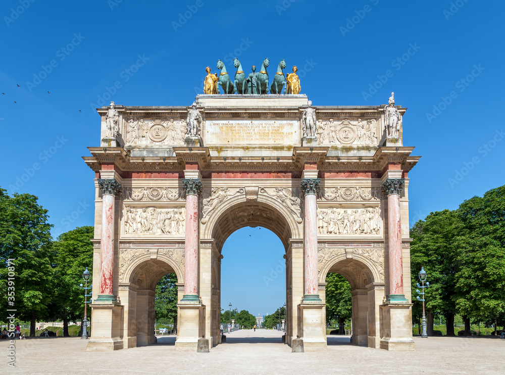 Deserted Carrousel Arch of Triumph with Luxor obelisk and arc de triomphe in the background - Paris, France Deserted Carrousel Arch of Triumph with Luxor obelisk and arc de triomphe in the background - Paris, France