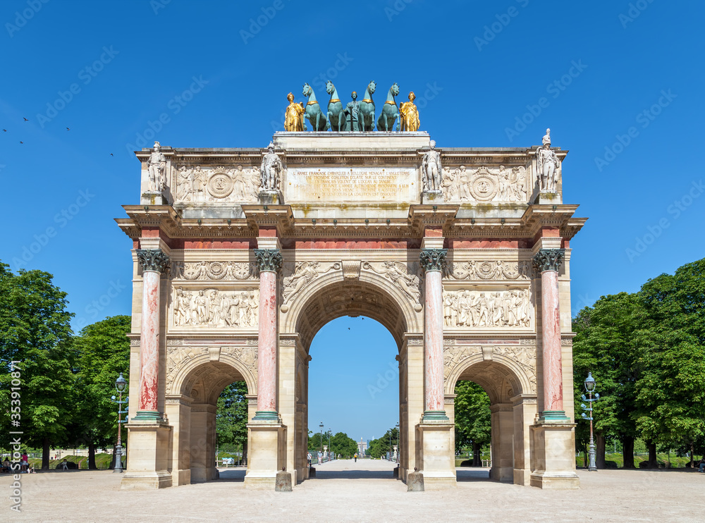 Deserted Carrousel Arch of Triumph with Luxor obelisk and arc de triomphe in the background - Paris, France