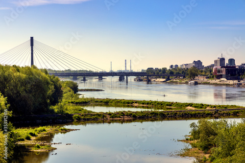 Panoramic view of Vistula river in central Warsaw  Poland with Swietokrzyski Bridge - Most Swietokrzyski - linking Powisle and Praga Polnoc districts