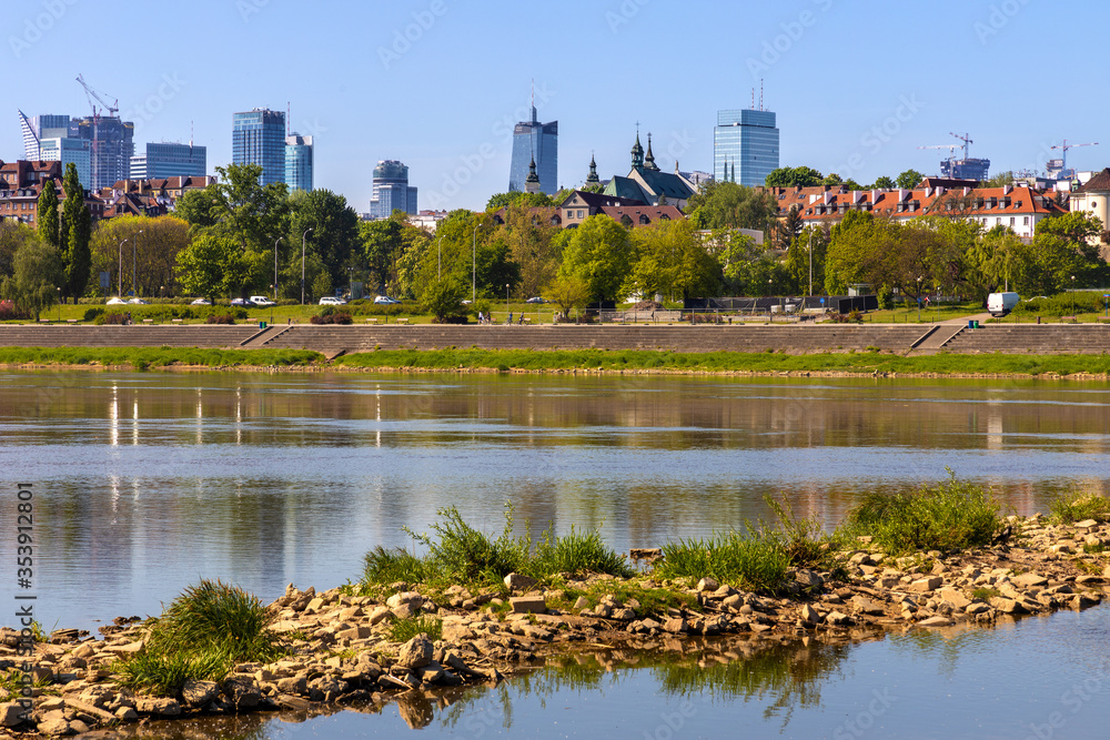 Panoramic view of Warsaw, Poland, city center and Old Town quarter with Wybrzerze Gdanskie embankment and wild banks of Vistula river