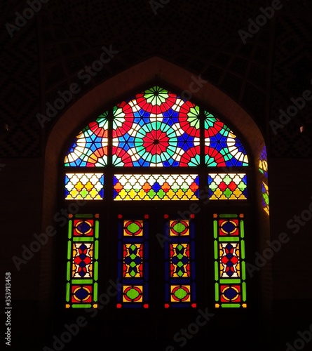The colourful stained glass with window arch frame at nasir al mulk mosque.the decoration of stained glass at window frame. the famous mosque at shiraz iran 