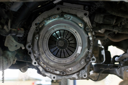 Car repair in a car service. Replacing the clutch of a gearbox on a car. New Clutch of a gearbox of a car close-up.