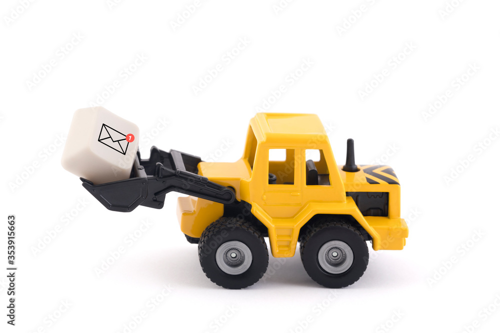 Bulldozer with new email graphic on computer key isolated on white background with clipping path Bulldozer with new email graphic on computer key isolated on white background with clipping path